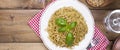 Italian pasta with pesto sauce and fresh basil. A delicious homemade dinner. Photo in a rustic style. Top view. Banner. Royalty Free Stock Photo