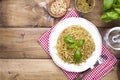 Italian pasta with pesto sauce and fresh basil. A delicious homemade dinner. Photo in a rustic style. Top view. copy space Royalty Free Stock Photo