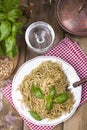 Italian pasta with pesto sauce and fresh basil. A delicious homemade dinner. Photo in a rustic style. Top view. copy space Royalty Free Stock Photo