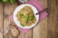 Italian pasta with pesto sauce and fresh basil. A delicious homemade dinner. Photo in a rustic style. Top view. copy space Royalty Free Stock Photo