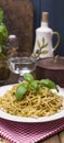 Italian pasta with pesto sauce and fresh basil. A delicious homemade dinner. Photo in a rustic style. Top view. copy space, Banner Royalty Free Stock Photo