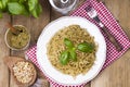 Italian pasta with pesto sauce and fresh basil. A delicious homemade dinner. Photo in a rustic style. Top view. Royalty Free Stock Photo