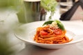 Italian pasta, pomodoro, bolognese. Tomato spaghetti with basil and cheese on a white plate, selective focus. Royalty Free Stock Photo