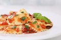 Italian Pasta Ravioli with tomato sauce noodles meal with basil Royalty Free Stock Photo