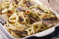 Italian pasta with sardines, fennel, raisins and pine nuts macro Royalty Free Stock Photo