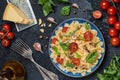 Italian pasta with sauce, cherry tomatoes, basil and parmesan cheese. Delicious pasta plate. Vegan pasta. Royalty Free Stock Photo