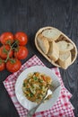 Italian pasta in a sauce with shrimps on a plate, top view. Dark wooden background. Space for text Royalty Free Stock Photo