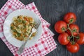 Italian pasta in a sauce with shrimps on a plate, top view. Dark wooden background. Space for text Royalty Free Stock Photo