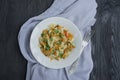 Italian pasta in a sauce with shrimps on a plate, top view. Dark wooden background. Space for text Royalty Free Stock Photo