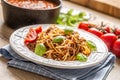 Italian pasta spaghetti bolognese served on white plate with parmesan cheese and basil Royalty Free Stock Photo