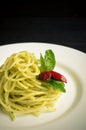 Italian pasta spaghetti with homemade pesto sauce and basil leaf Royalty Free Stock Photo