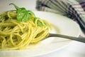 Italian pasta spaghetti with homemade pesto sauce and basil leaf Royalty Free Stock Photo