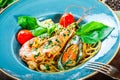 Italian pasta spaghetti with seafood, langoustine, mussels, squid, scallops, shrimp, Parmesan cheese Royalty Free Stock Photo