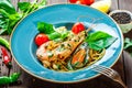 Italian pasta spaghetti with seafood, langoustine, mussels, squid, scallops, shrimp, Parmesan cheese,