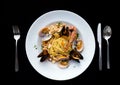 Pasta spaghetti seafood with mussels and shrimps and tomatoes, with parsley Royalty Free Stock Photo