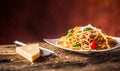 Italian pasta spaghetti with tomato sauce basil and parmesan cheese in white plate Royalty Free Stock Photo