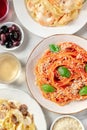 Italian pasta. Spaghetti with tomato sauce and basil, wine, Parmesan cheese Royalty Free Stock Photo