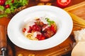 Italian pasta. Spaghetti with tomato sauce and meatballs on white plate with parmesan cheese, fresh parsley and tomatoes. Royalty Free Stock Photo