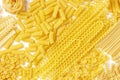 Italian pasta texture, flat lay banner, shot from the top on a white background. Fusilli, farfalle, macaroni, spaghetti Royalty Free Stock Photo