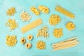 Italian pasta variety, flat lay banner, shot from above on a teal background