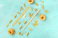 Italian pasta of various sorts, a flat lay banner, shot from above on teal blue