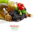 Italian Pasta with vegetables in wooden plate isolated on white.