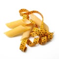 Italian pasta on white background with metre Royalty Free Stock Photo