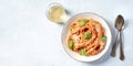 Italian pasta and wine panorama. Spaghetti with tomato sauce, cheese and basil, shot from the top Royalty Free Stock Photo