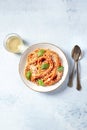 Italian pasta with wine. Spaghetti with tomato sauce, cheese and basil, shot from the top Royalty Free Stock Photo