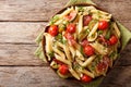 Italian penne pasta with ham prosciutto, tomato, zucchini and pa Royalty Free Stock Photo