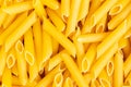 Italian Penne Rigate Macaroni Pasta raw food background Royalty Free Stock Photo