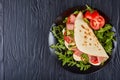 Italian piadina with mozzarella, tomato, salami Royalty Free Stock Photo