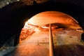 Italian pizza being baked in traditional wood flame fire oven Royalty Free Stock Photo