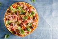 Italian pizza on blue rustic textile Royalty Free Stock Photo