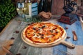 Italian pizza capricciosa mushrooms olives salami Royalty Free Stock Photo