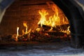 Pizza, oven, cooked, wood-fired, burning wood, fireplace, italian, pizzeria, cooking, flame, Royalty Free Stock Photo