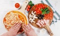 Italian pizza cooking process on white table. Backstage of preparation. Process step by step. Pizza dough and ingredients. Royalty Free Stock Photo