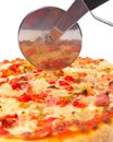 Italian pizza and cutter Royalty Free Stock Photo