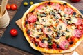 Italian pizza. Delicious fresh baked pizza served on wooden table Royalty Free Stock Photo