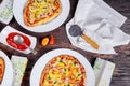 Italian Pizza Restaurant Menu - Margarita and Salmon Pizza. Pizza Dinner. pizzas served on wooden table Top View Royalty Free Stock Photo