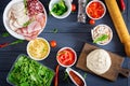 Italian pizza. Dough and pizza ingredients. Dough, cheese, tomatoes, broccoli Royalty Free Stock Photo