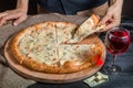 Italian pizza 4 four cheese on the Board with pizza cutter and wine Royalty Free Stock Photo