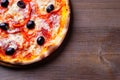 Italian pizza with ham and black olives Royalty Free Stock Photo