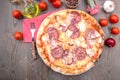 Italian pizza with pepperoni and mushrooms Royalty Free Stock Photo