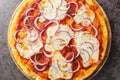 Italian Pizza pugliese topped with tomato sauce, melted cheese and lots of red onion close-up on a wooden board. Horizontal top Royalty Free Stock Photo