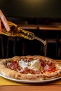 Italian pizza with real, cold-pressed olive oil, burrata, ham from Parma Royalty Free Stock Photo