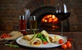 Italian pizza in a wood-burning stove Royalty Free Stock Photo