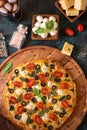 Italian Pizza Wooden Board Ingredients Mazzarella Cheese Basil Spices Black Green View from above