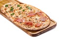 Italian pizza on a wooden chopping board. Royalty Free Stock Photo