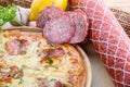 ITALIAN PIZZA on wooden table. True hot tasty PIZZA with salami, mushrooms, basil, olives, pepper and cheese. Nice for menu Royalty Free Stock Photo